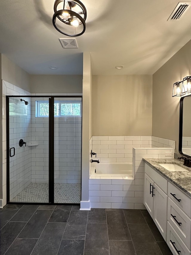 2725 Masterson Ln, Tallahassee, FL 32311 - bathroom with visible vents, a garden tub, a shower stall, and vanity