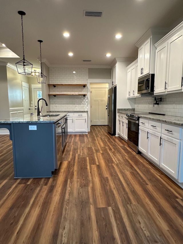 2725 Masterson Ln, Tallahassee, FL 32311 - kitchen with white cabinetry, visible vents, appliances with stainless steel finishes, and a sink