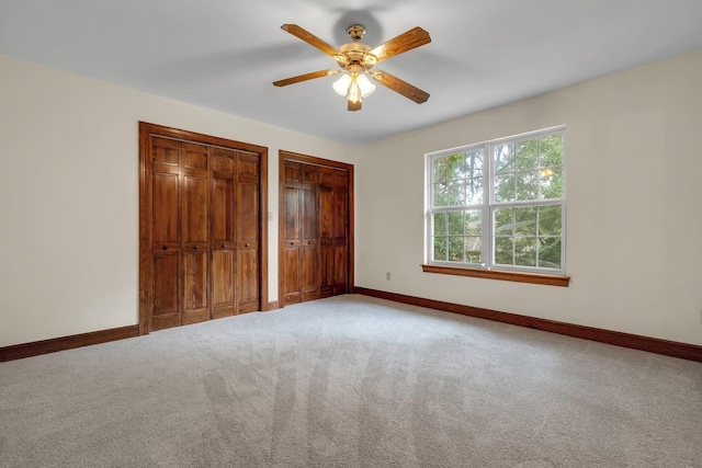 332 Winnstead Ct, Tallahassee, FL 32312 - unfurnished bedroom featuring two closets, carpet flooring, and ceiling fan