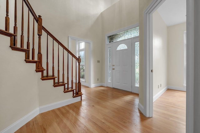 332 Winnstead Ct, Tallahassee, FL 32312 - entryway featuring light wood finished floors, stairway, and a high ceiling