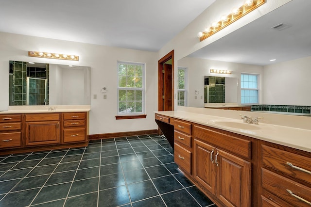 332 Winnstead Ct, Tallahassee, FL 32312 - bathroom with two vanities, healthy amount of natural light, tile patterned flooring, and tiled shower