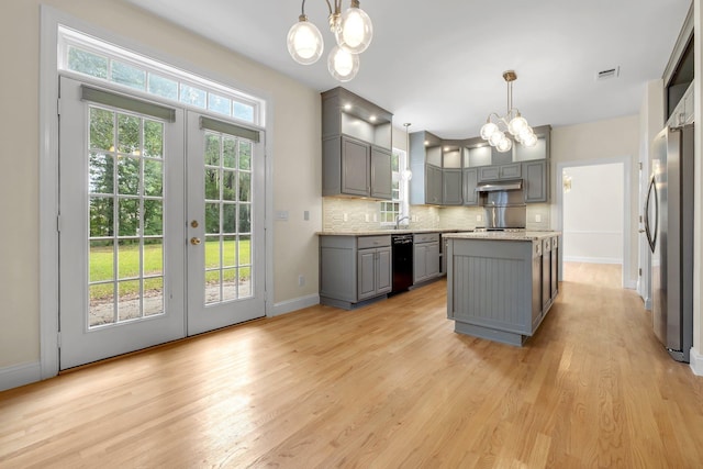 332 Winnstead Ct, Tallahassee, FL 32312 - kitchen with gray cabinetry, a chandelier, black dishwasher, french doors, and light wood-style flooring