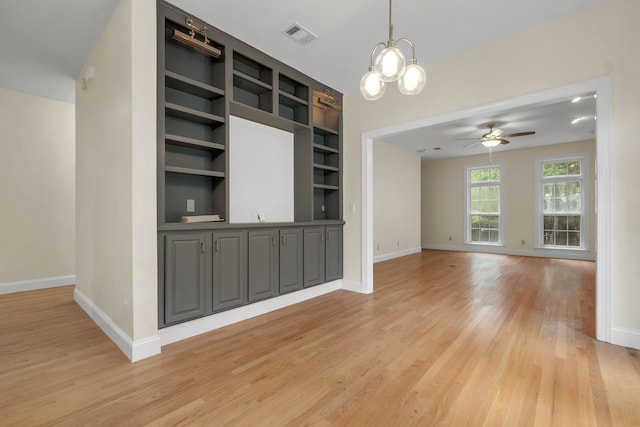 332 Winnstead Ct, Tallahassee, FL 32312 - unfurnished living room featuring light wood finished floors, ceiling fan, and a chandelier