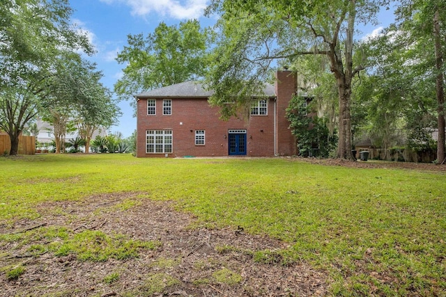 332 Winnstead Ct, Tallahassee, FL 32312 - back of property with french doors, a chimney, a yard, and brick siding