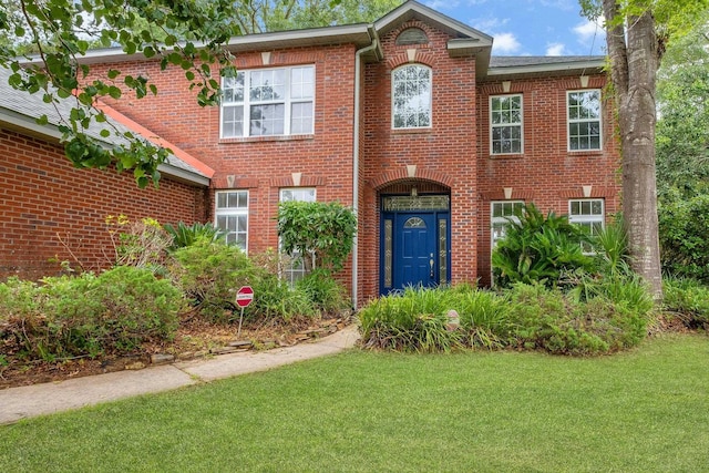 332 Winnstead Ct, Tallahassee, FL 32312 - view of front of house with brick siding and a front lawn