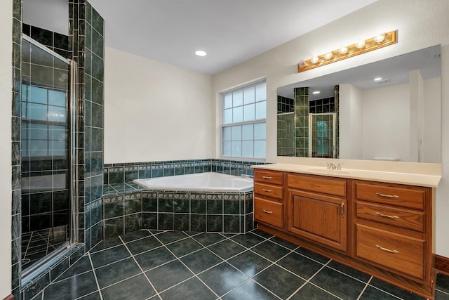 332 Winnstead Ct, Tallahassee, FL 32312 - full bath featuring a garden tub, vanity, tile patterned floors, and tiled shower