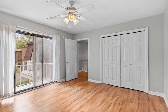 unfurnished bedroom with ceiling fan, light hardwood / wood-style floors, access to exterior, and multiple windows