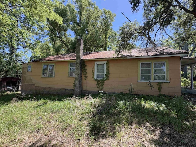 810 Taylor St Unit 1 & 2, Tallahassee, FL 32310 - view of side of home with a chimney and metal roof