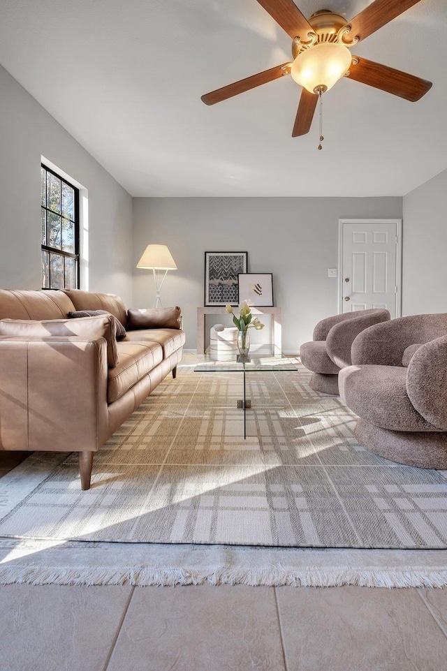 living area featuring ceiling fan