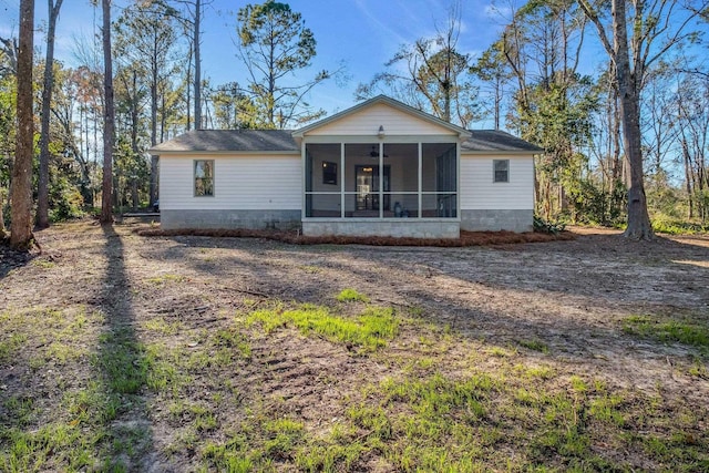 view of front of home with a sunroom and ceiling fan