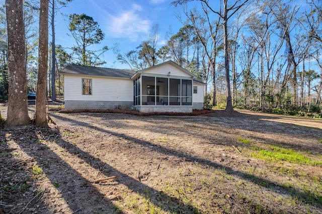 view of front of property with a sunroom