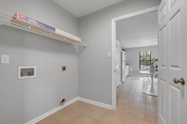 laundry area featuring washer hookup, light tile patterned floors, hookup for an electric dryer, laundry area, and baseboards