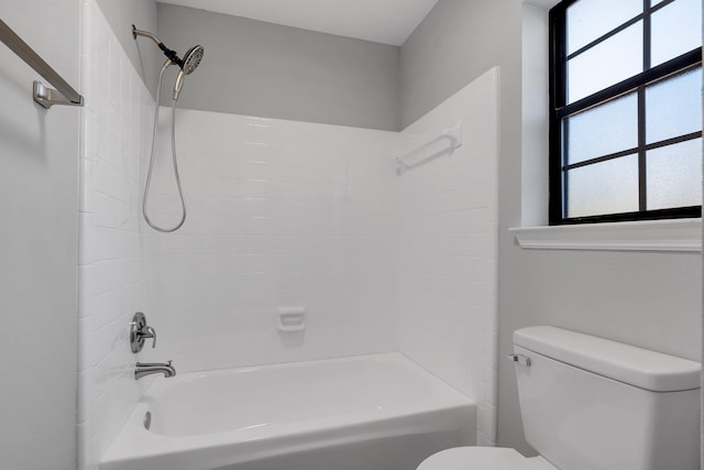 bathroom with toilet and tub / shower combination