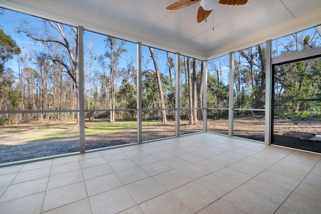 unfurnished sunroom featuring ceiling fan