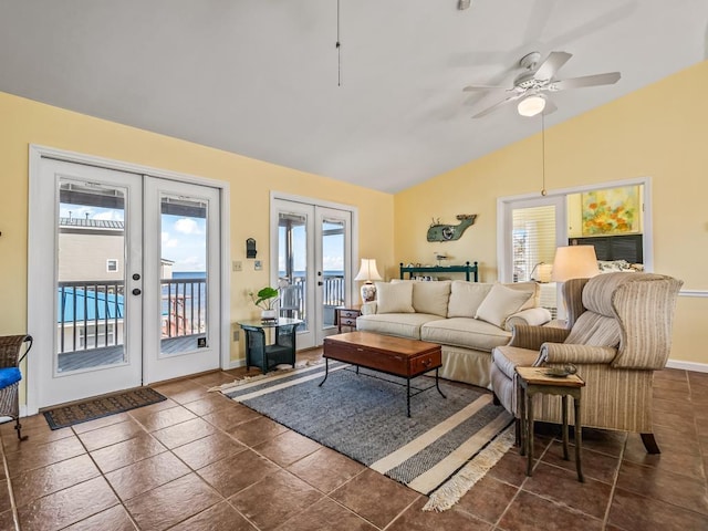 living room featuring lofted ceiling, ceiling fan, and french doors