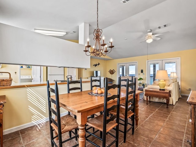 tiled dining area featuring vaulted ceiling and ceiling fan