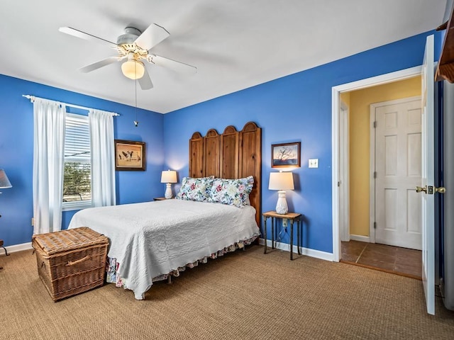 bedroom with ceiling fan and carpet flooring