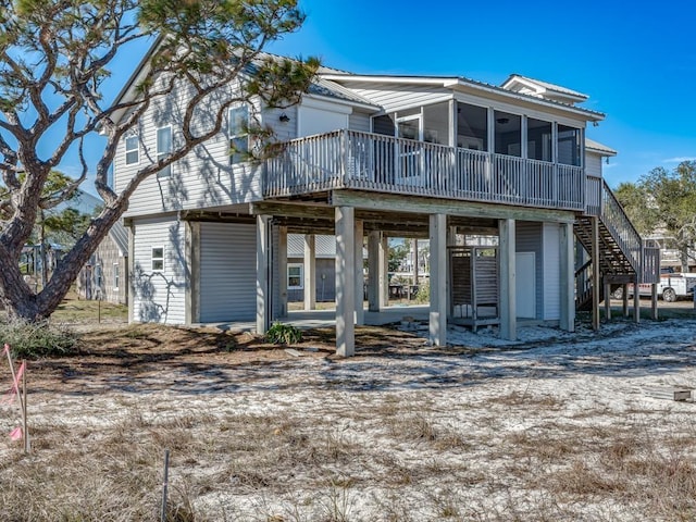 view of front of home featuring a sunroom