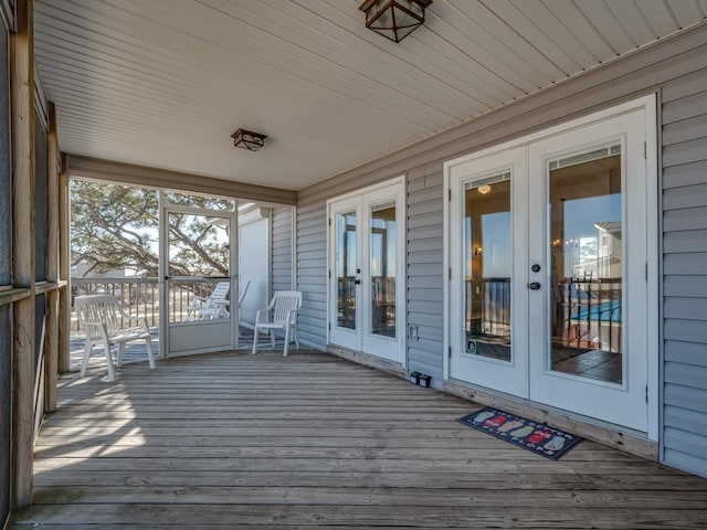 wooden deck featuring french doors