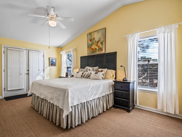 carpeted bedroom featuring lofted ceiling and ceiling fan