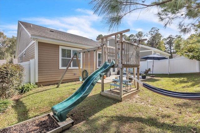 view of jungle gym featuring a lawn