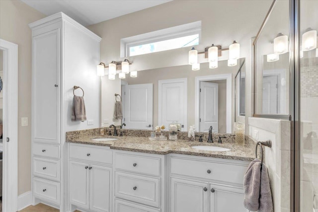 bathroom with vanity and walk in shower