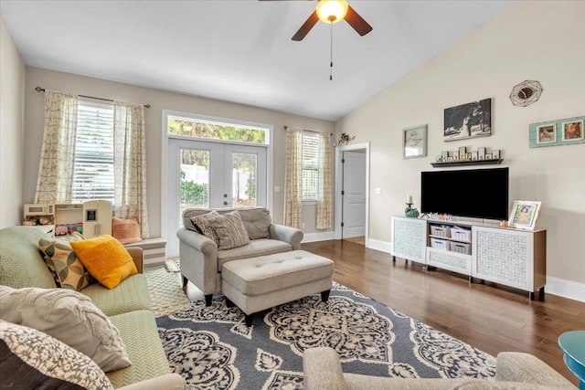 living room with vaulted ceiling, ceiling fan, dark hardwood / wood-style flooring, and french doors