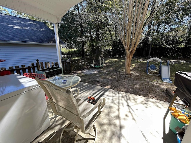 view of patio with a grill