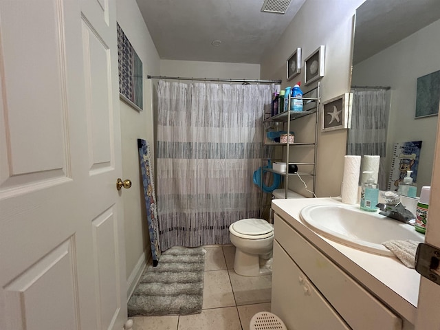 bathroom featuring a shower with shower curtain, vanity, toilet, and tile patterned flooring