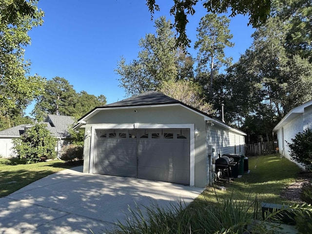 garage featuring a yard