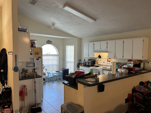 kitchen featuring lofted ceiling, light tile patterned floors, white cabinetry, white range with electric stovetop, and kitchen peninsula