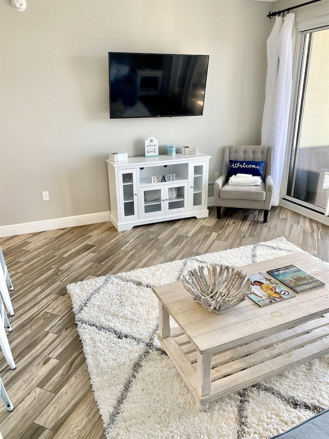 122 Seascape Dr Unit 1406, Destin, FL 32550 - living room with baseboards and wood finished floors