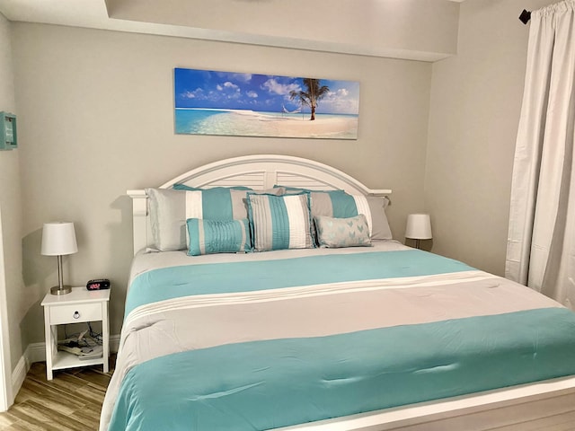 122 Seascape Dr Unit 1406, Destin, FL 32550 - bedroom featuring wood finished floors and baseboards