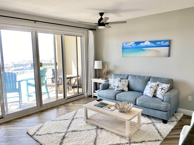 122 Seascape Dr Unit 1406, Destin, FL 32550 - living room featuring plenty of natural light, wood finished floors, and a ceiling fan
