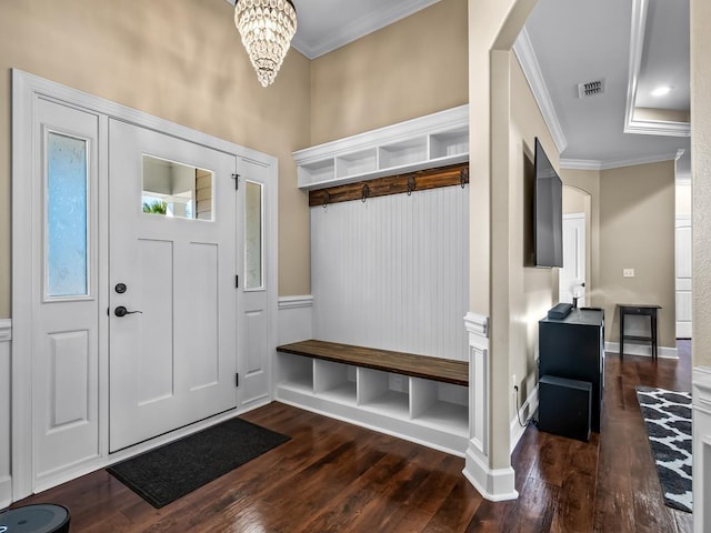 mudroom with a notable chandelier, crown molding, and dark wood-type flooring