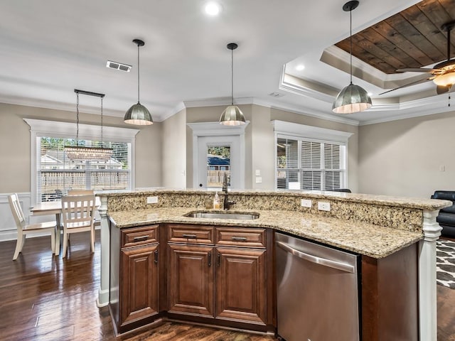 kitchen featuring a raised ceiling, crown molding, sink, hanging light fixtures, and stainless steel dishwasher