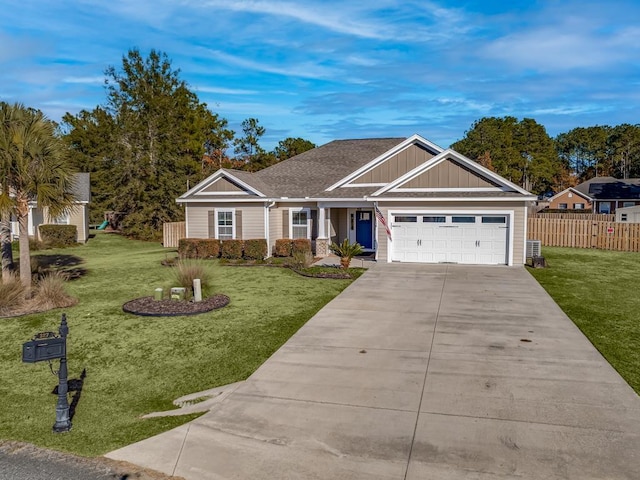 view of front of house featuring a front lawn and a garage