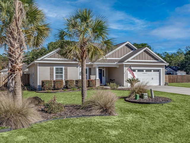 view of front of property featuring a garage and a front yard