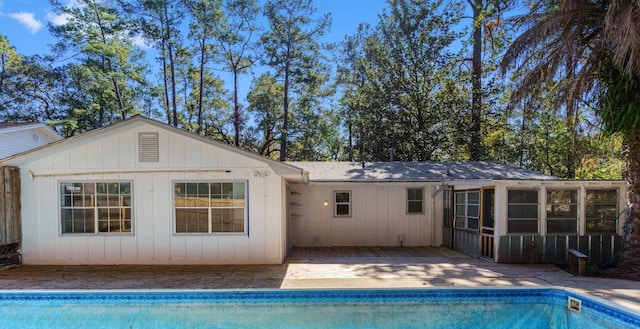 rear view of house with a sunroom