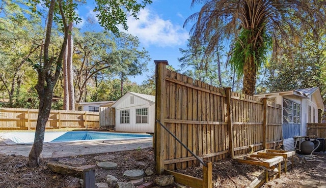 view of swimming pool with an outdoor structure