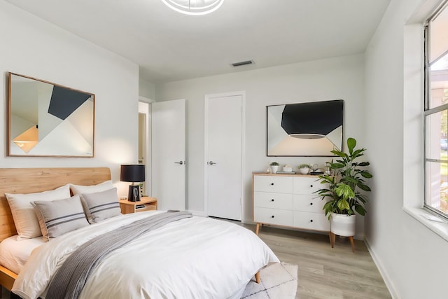 bedroom with light wood-type flooring