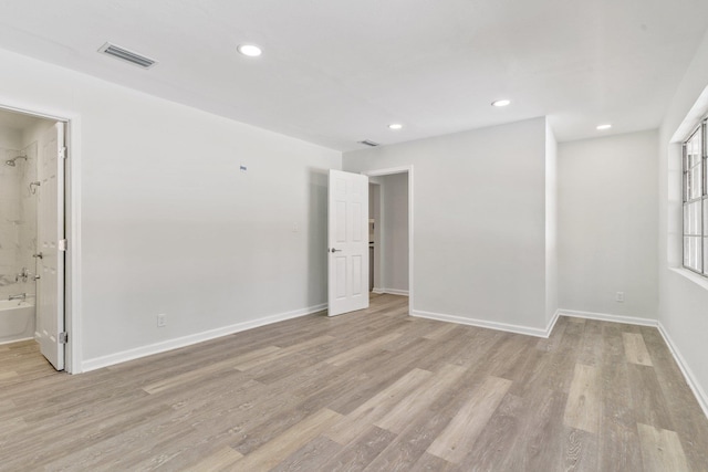 spare room with light hardwood / wood-style floors