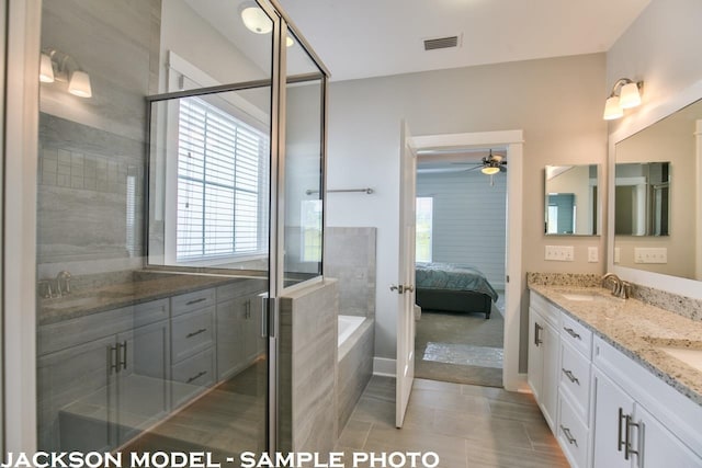 bathroom featuring ceiling fan, tile patterned flooring, vanity, and shower with separate bathtub