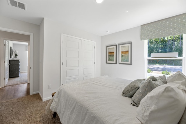 carpeted bedroom with a closet