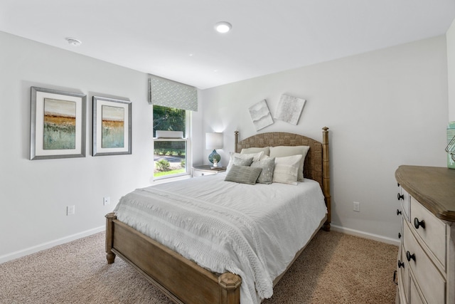 bedroom with light colored carpet