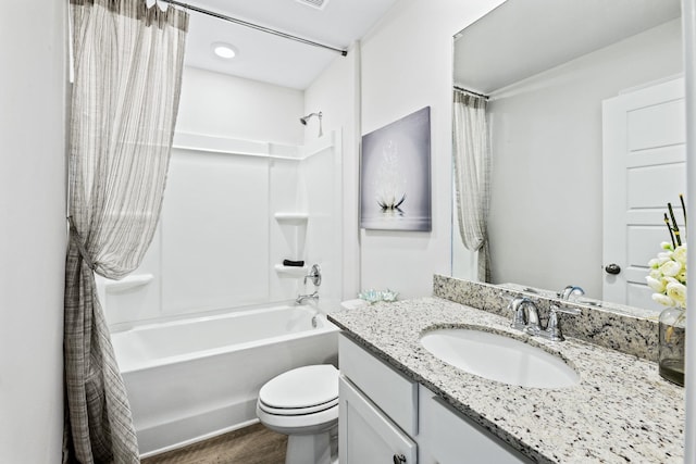 full bathroom featuring hardwood / wood-style flooring, vanity, toilet, and shower / bath combination with curtain