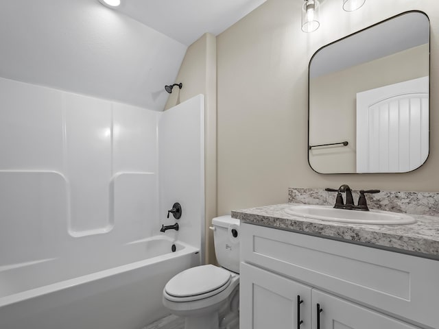 full bathroom featuring tub / shower combination, toilet, vanity, and vaulted ceiling