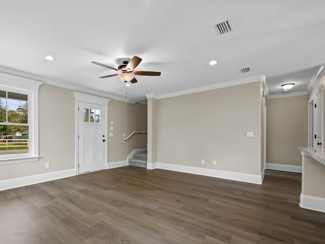 interior space with ceiling fan, ornamental molding, and dark hardwood / wood-style floors