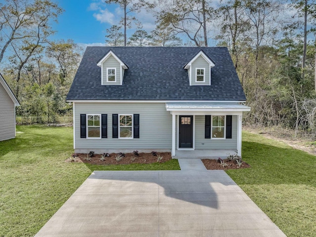 cape cod home with covered porch and a front yard