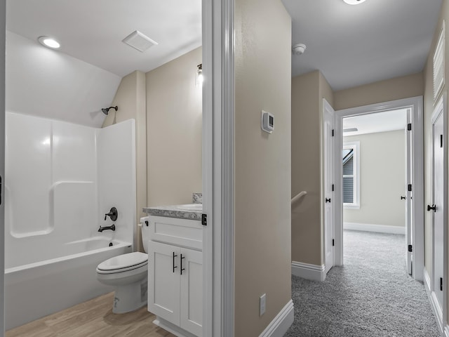 full bathroom with vanity, toilet, and  shower combination